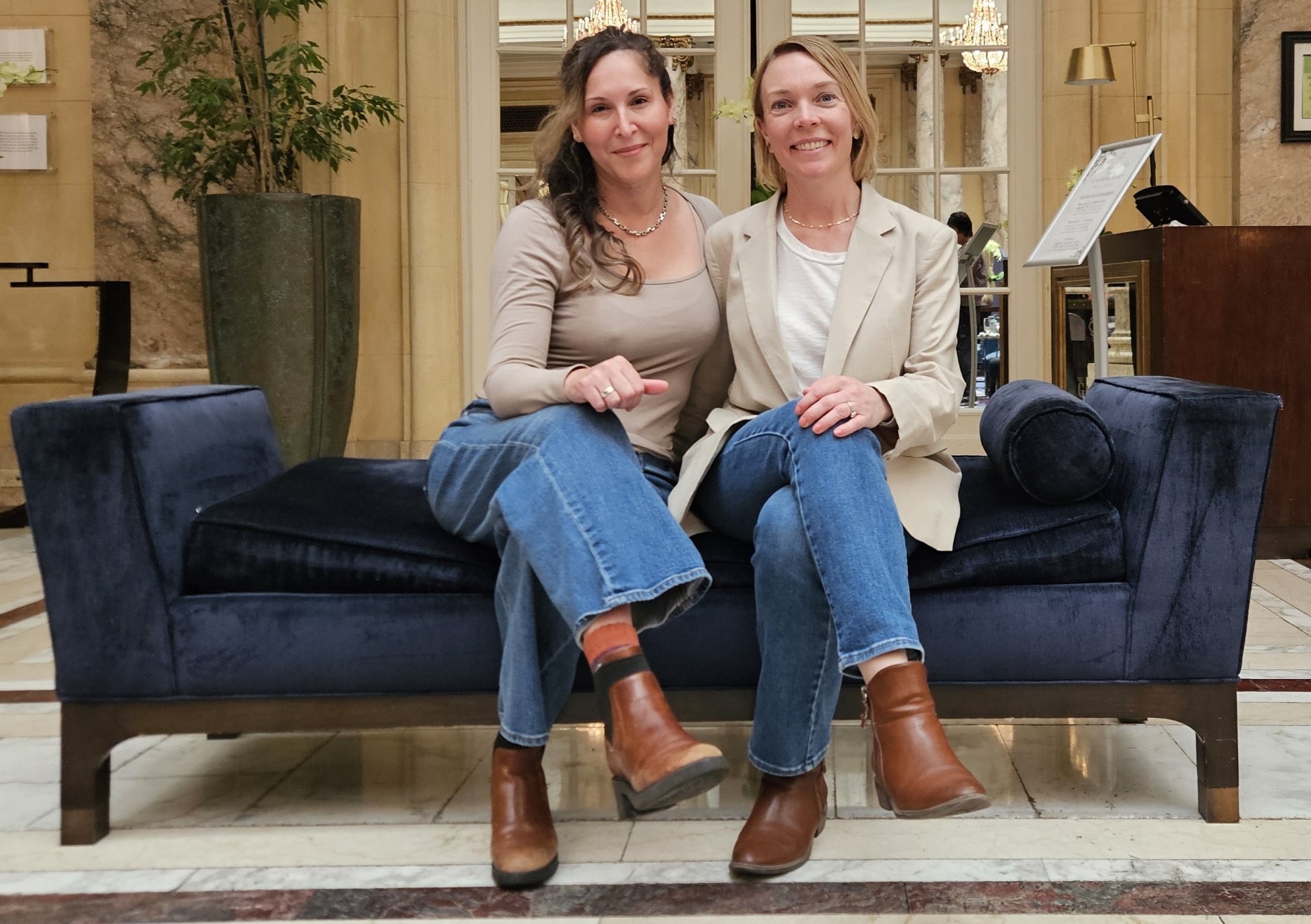 The TheraNanny founders sitting together in a hotel lobby